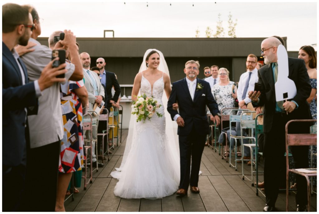Maddie walks up the aisle with her father