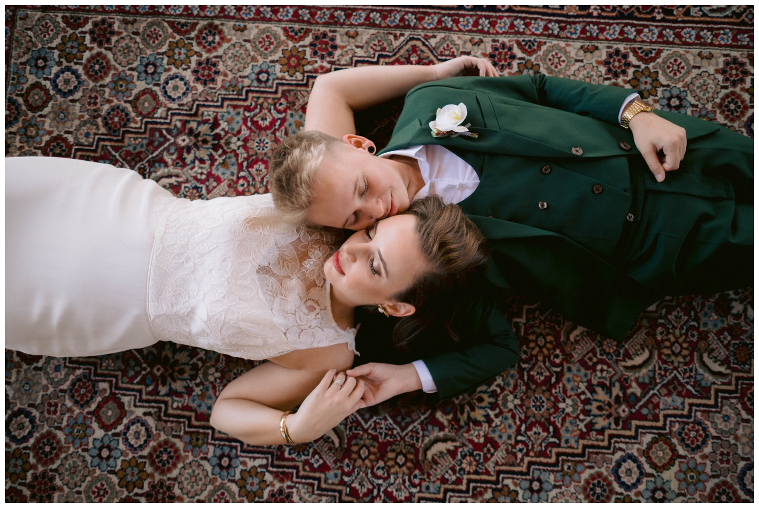 A couple lays on a rug at their Livaudais Hall wedding