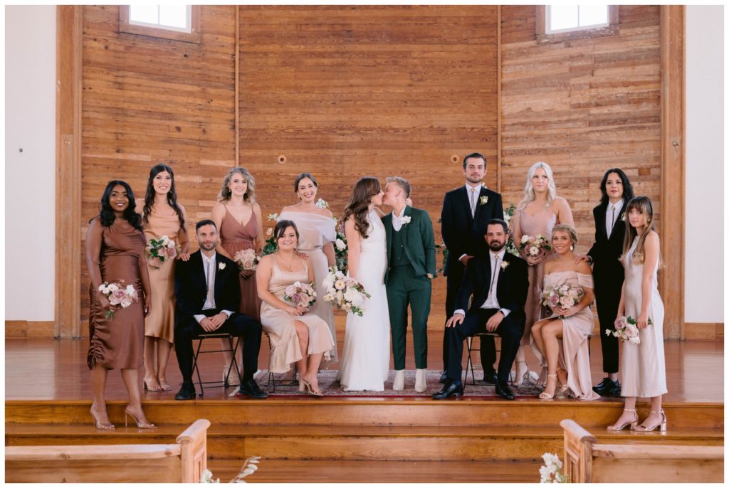 The wedding party poses in the sanctuary at Livaudais Hall