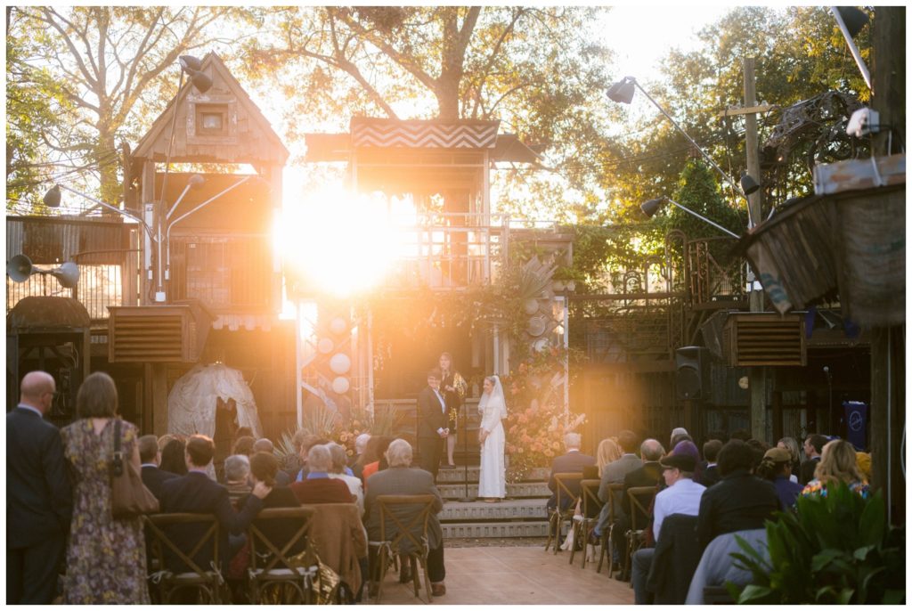 The sun shines through the structures at the Music Box Village