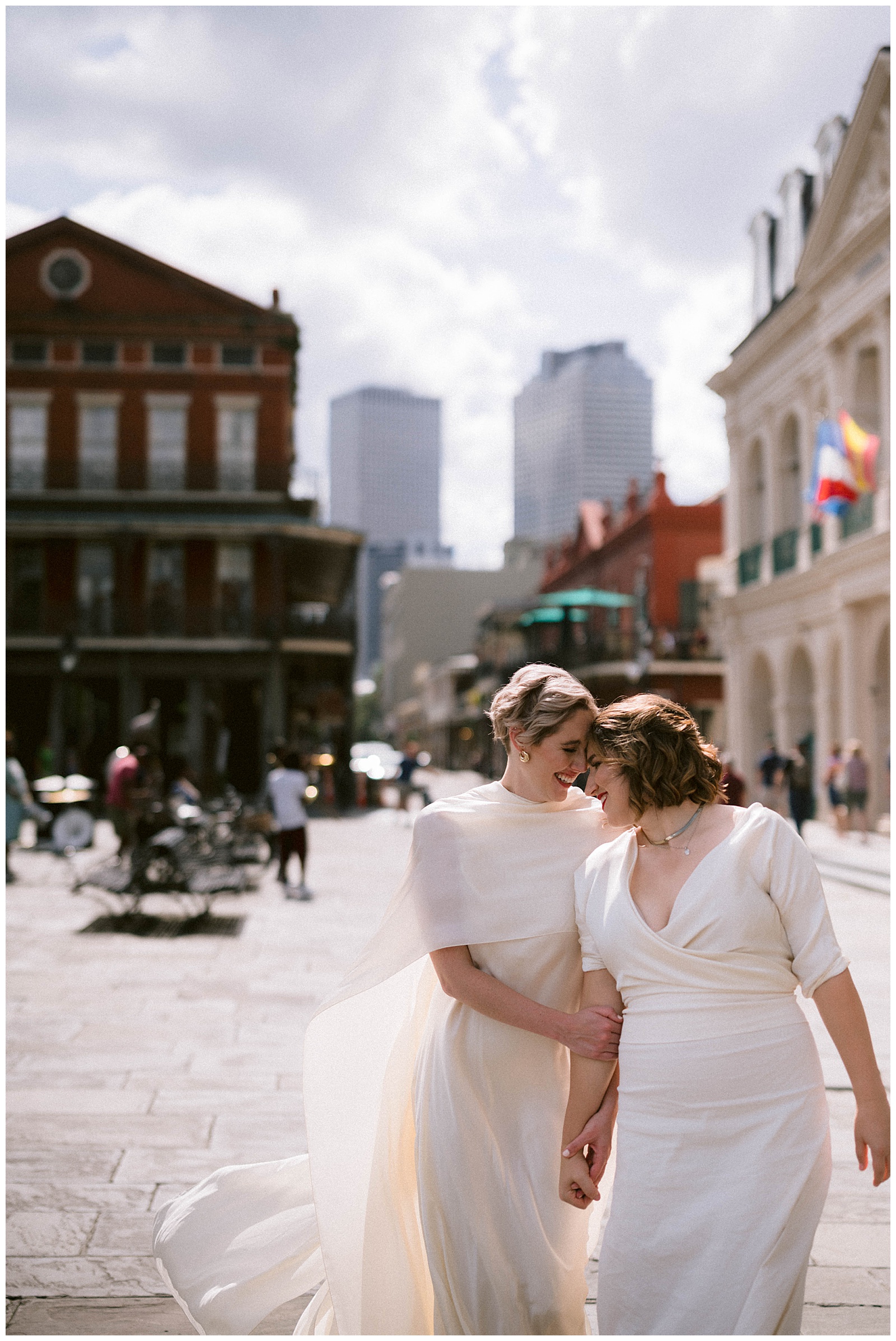 A marrier wears a cape at a French Quarter wedding
