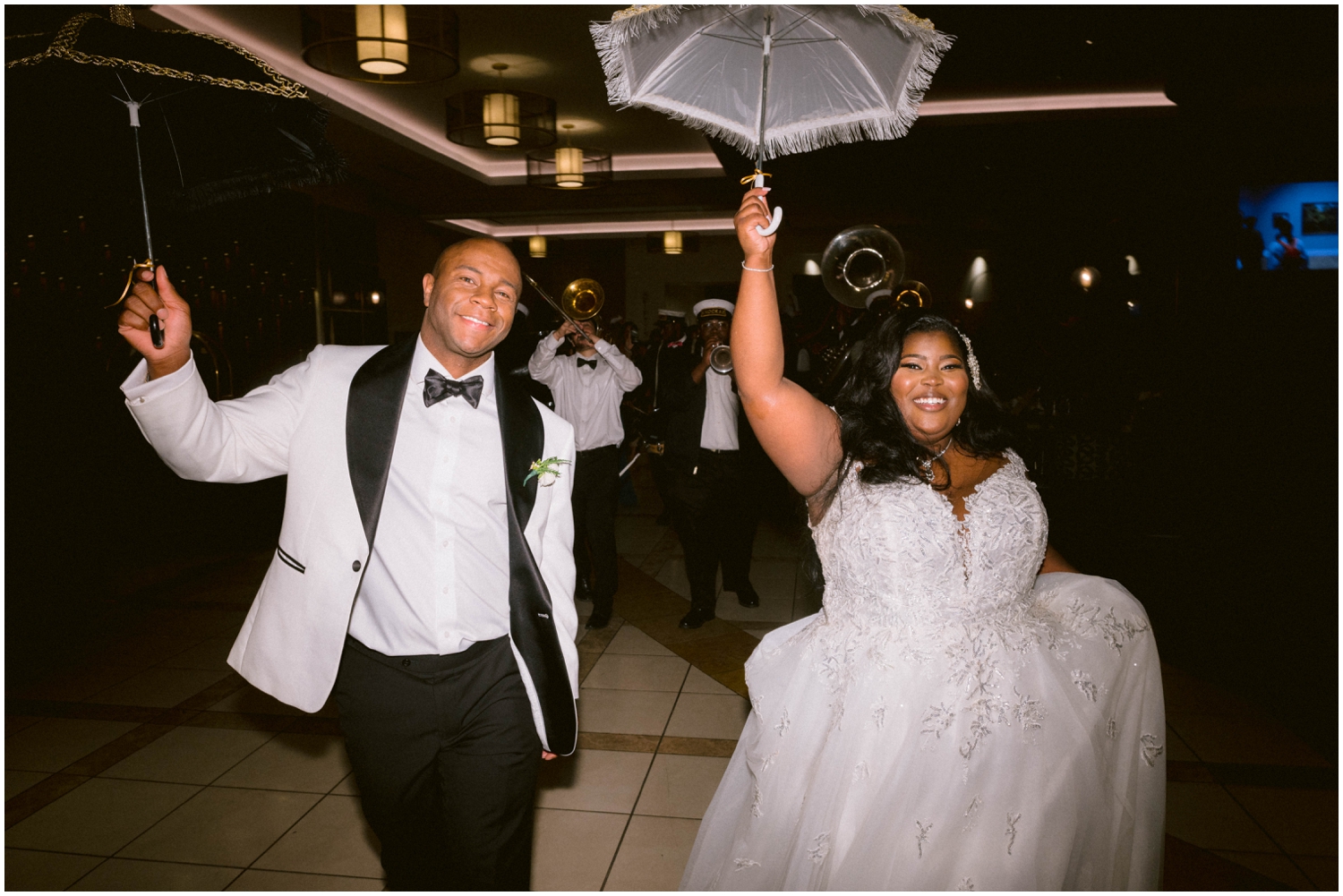 Bruce and Alonna lead a second line band at the end of their New Orleans wedding.
