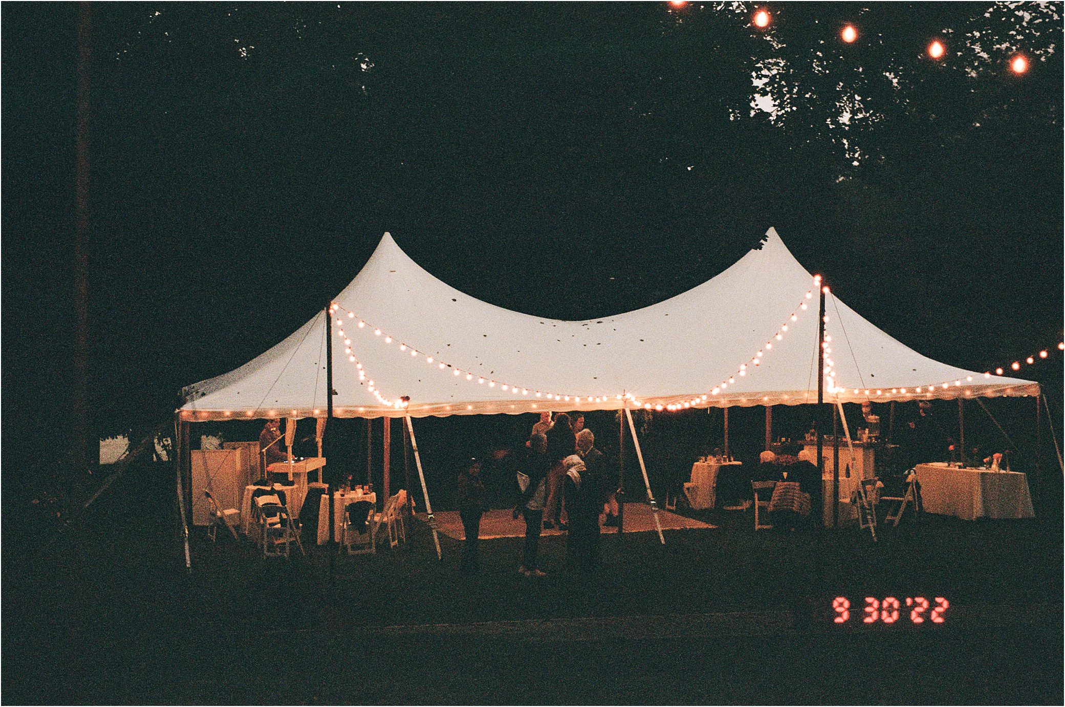 A wedding photo on film shows the end of a New England wedding reception.