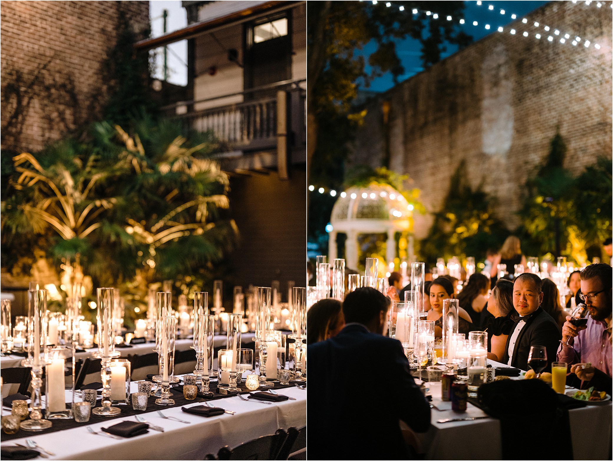 Guests sit at reception tables to eat a meal by candle light. 