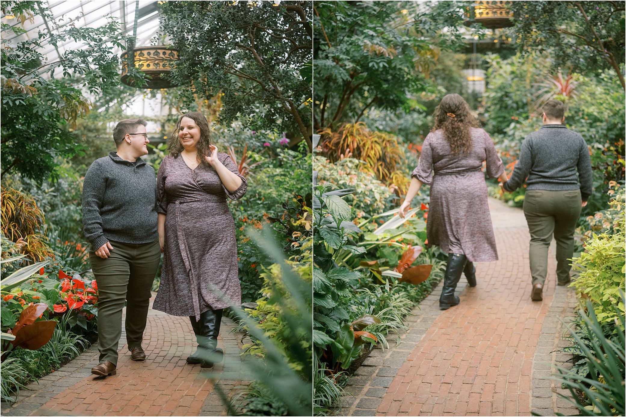 An engaged couple walks down a flower-lined path in a Philadelphia botanical garden.
