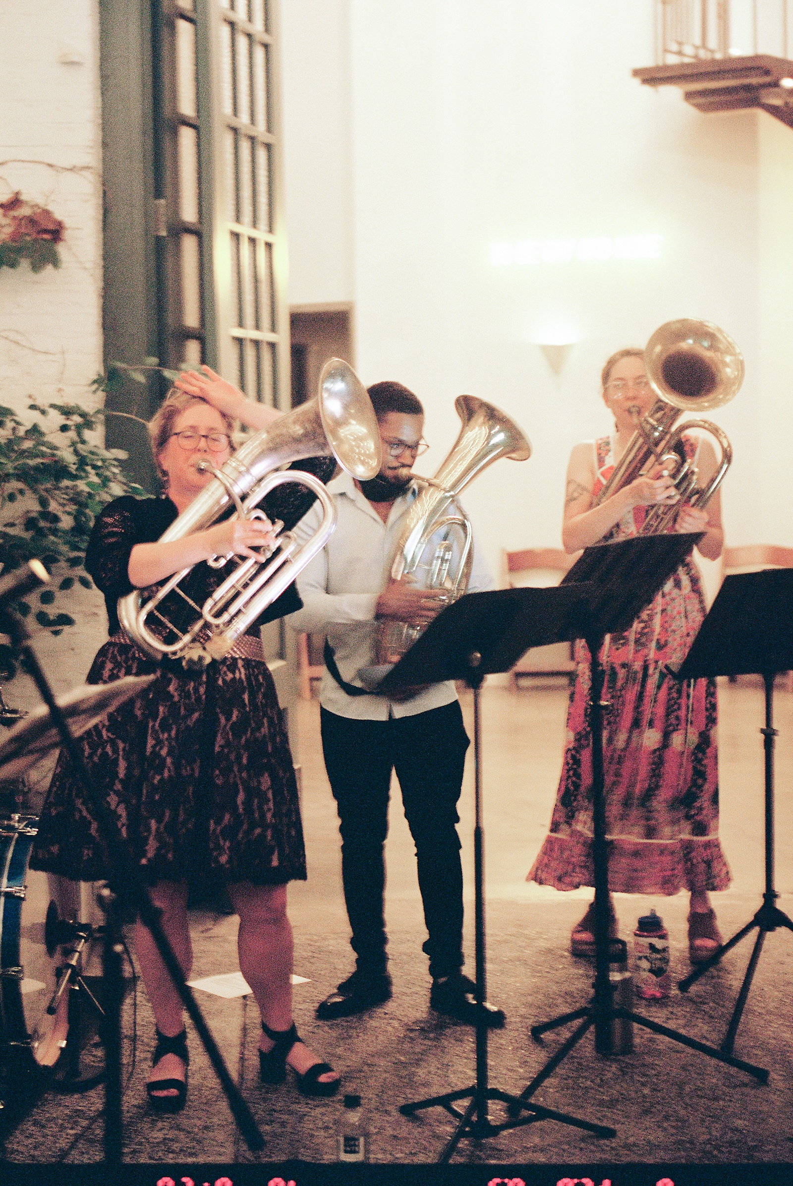 A wedding band plays brass instruments at a Philadelphia wedding venue courtyard.