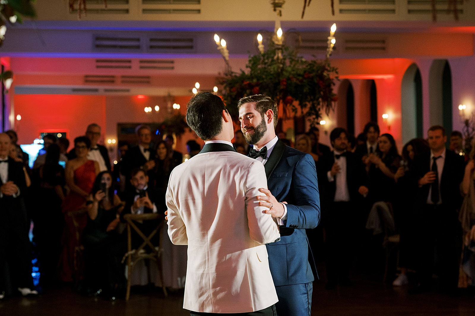 Two grooms share their first dance at Il Mercato.