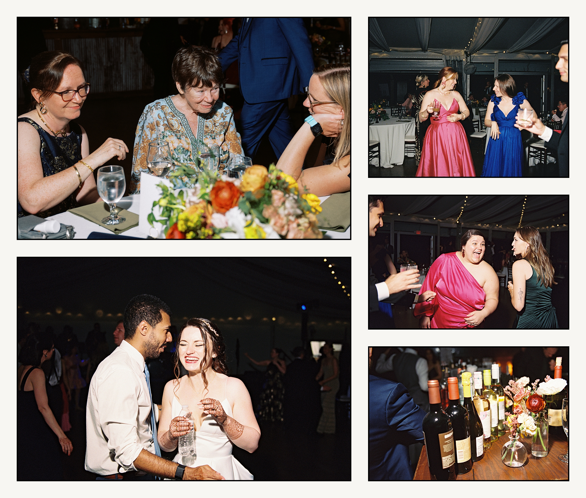 Wedding guests sit around a reception table laughing.